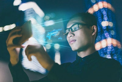 Businessman using futuristic mobile phone