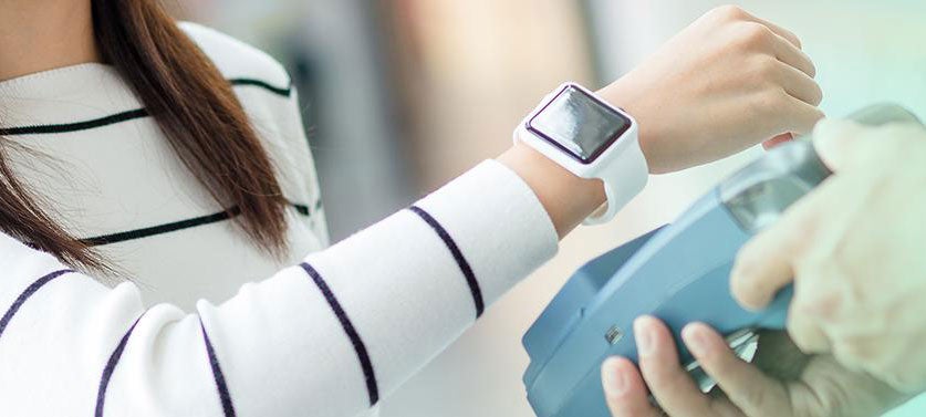 Customer using a smart watch to pay