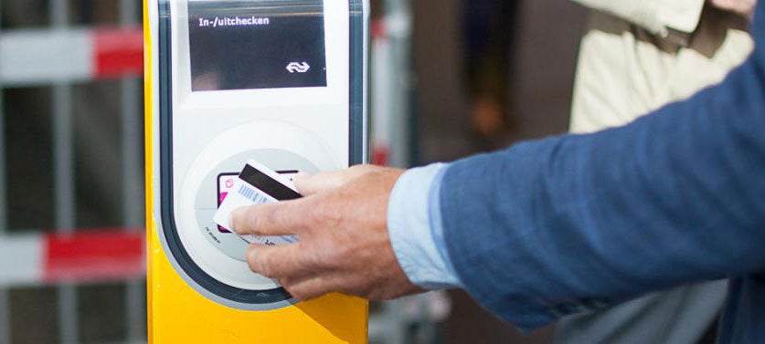 A man using an OV card to ride the subway