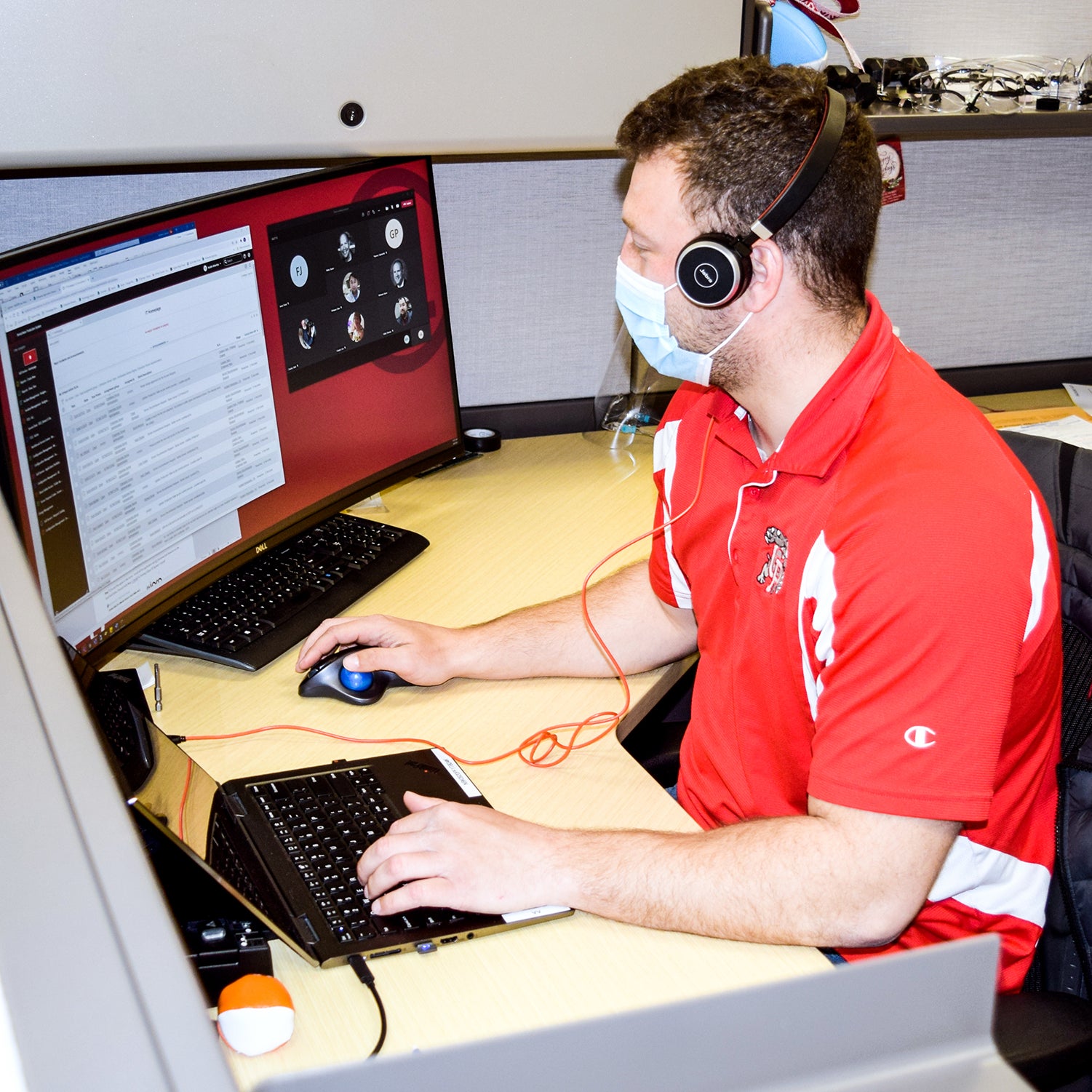 UL employee on a remote call while wearing a surgical mask